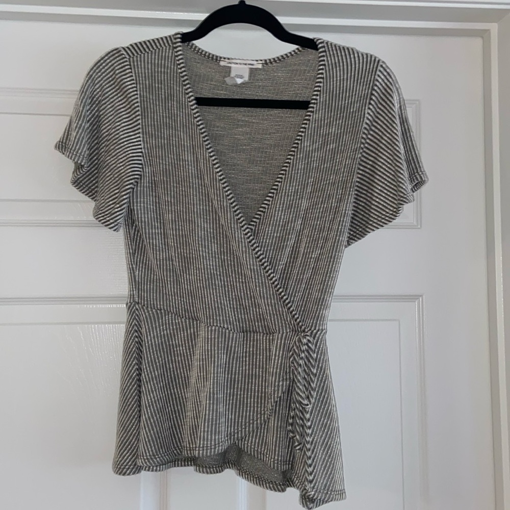 Green and white stripe Caution to the Wind shirt. Size Medium.